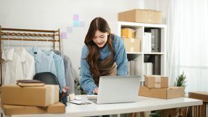 Young Entrepreneur or Small Business Owner Preparing Online Orders at Home Office.